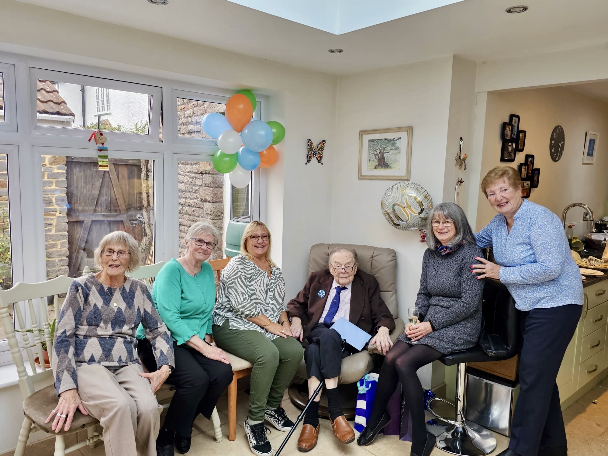 John with people who worked at John Brown Hardware, gathered for his 100th birthday