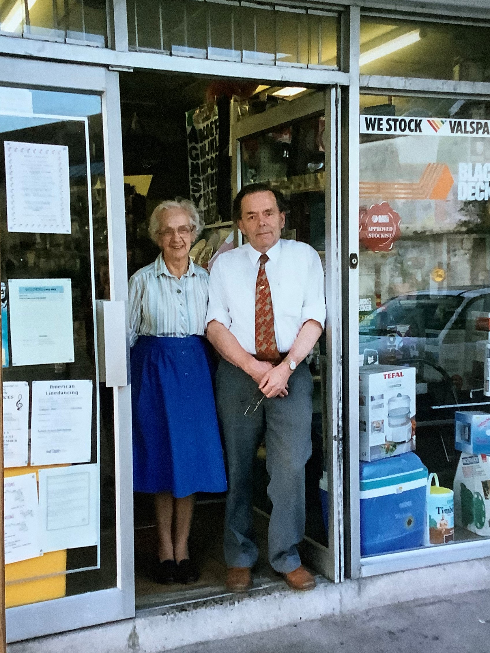 John and Alice Brown standing in the shop doorway