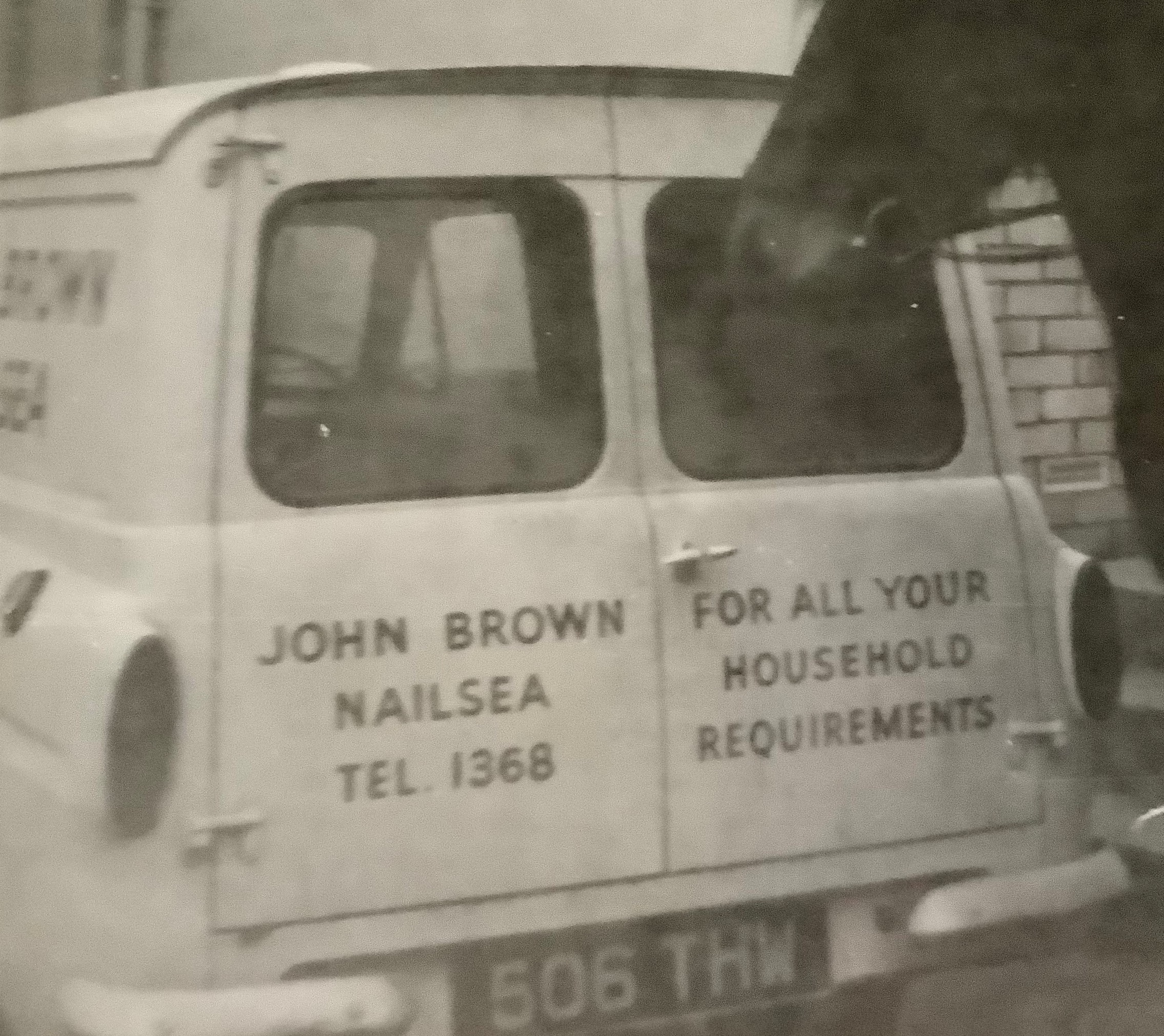 Rear doors of the shop van lettered “John Brown, Nailsea, Tel. 1368 · For all your household requirements”
